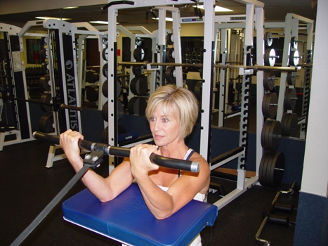 Canice performs curls in her own gym, one of the many workout sites she used during her six-week training course. 