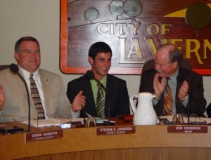 Damien's Thomas Nolan shares a political moment with Council Member Steve Johnson, left, and Mayor Don Kendrick.