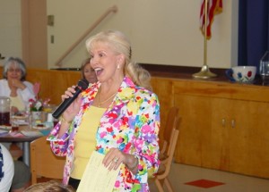 San Gabriel Valley Women's Auxiliary President Dena Miller made sure everybody was having a good time at its "Cup of Kindness" fundraiser to benefit the McKinley Children's Center.