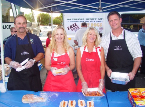 Would you like mustard and relish with your hot dog? Servers, from left, were Fire Chief John Breaux, Councilwoman Robin Carder, Councilwoman Donna Nasmyth and Police Chief Scott Pickwith.