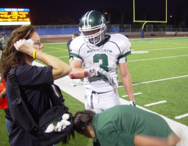 Casey Horine received medical attention for a bloody elbow before he reentered the game to block a Baldwin Park punt.