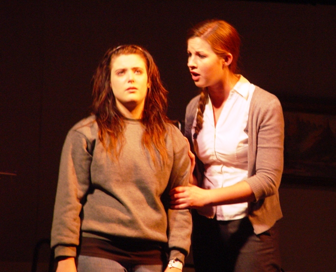 Ariana Harris, as Susan Connors, wrestles with her inner voice, The Speaker, portrayed by Julianne O' Brien.
