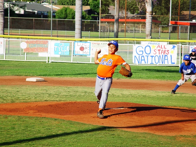 Stephen Bustos reaches back to deliver a fastball.
