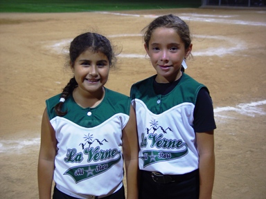 Navarette, right, with hitting star Ashley Alvarez, who was 2-for-2 with two RBIs.