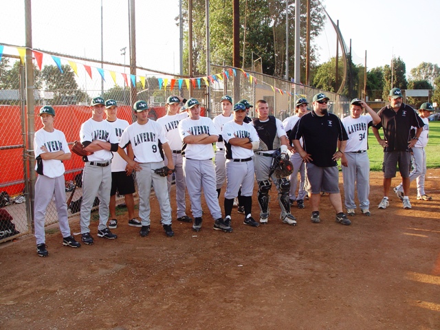 La Verne players assembled outside the dugout before the start of play.