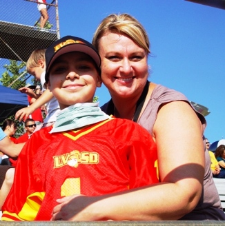 Noah and his mom Alaina at a Pop Warner football game last season.