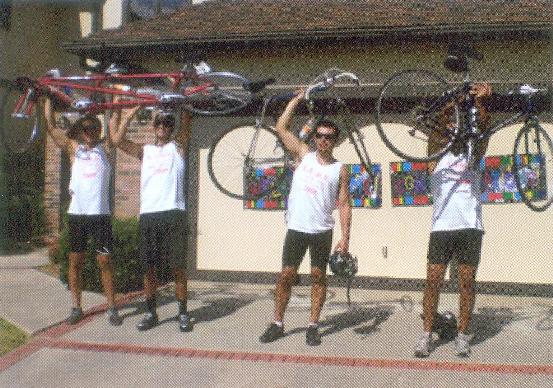Mark, far left, and Jeremy hoist their tandem bike that will take them from Santa Barbara to San Diego over four days beginning Aug. 26.
