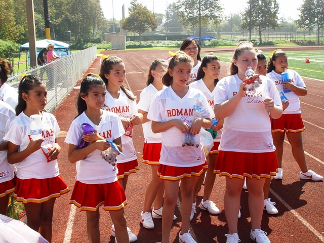 Romans cheerleaders take a breather after cheering home 38 points.