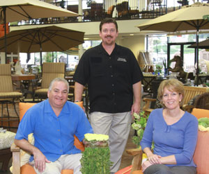 Seated, Outdoor Elegance owners Doug and Sharon Sanicola with General Manager Tom Kay.