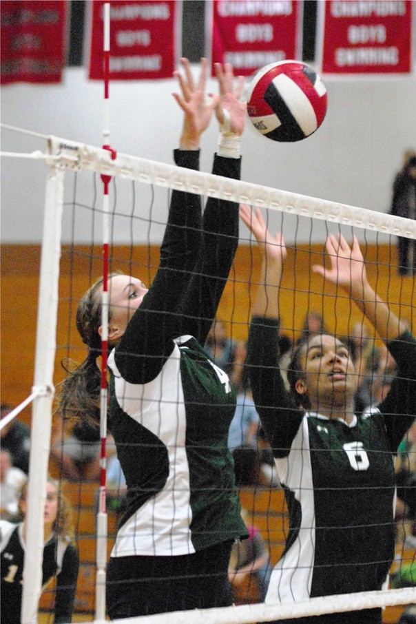 Danielle Lines and Briana Kennedy set up for a block.