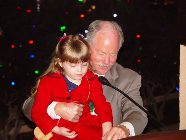 A child's touch, with assitance from Mayor Don Kendrick, helped light the City tree.