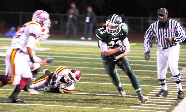 Garrett Horine protects the ball as he fights for yardage.