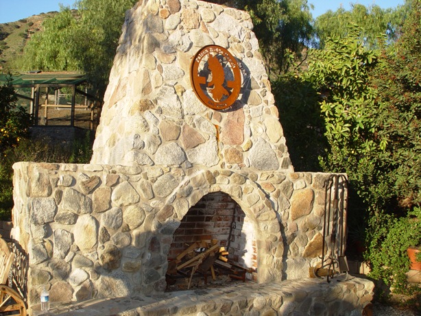 An outdoor fireplace on the ranch, which also hosts Boy Scout and Girl Scout troops.