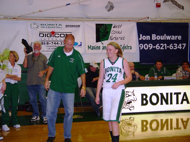 Coach Darren Baumunk with a surprised and honored Madison Zylstra.