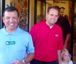 Ernie Dorado, left, and owner Steven Paul, moments after the ribbon-cutting.