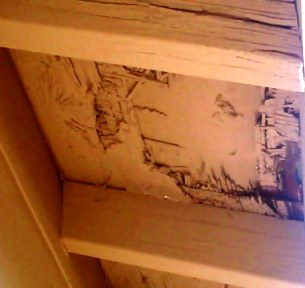 Damaged area under the eaves.