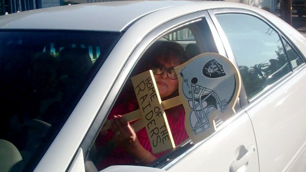 During the interview, Anna Hernandez of Downey, purchased a popular Oakland Raiders yard sign for a business associate.