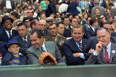 Nixon chats with a future voter at the Washington Senators' 1969 Opening Day, with Baseball Commissioner Bowie Kuhn (to the right of Nixon), Senators owner Bob Short and Nixon aide Jack Brennan (in uniform).